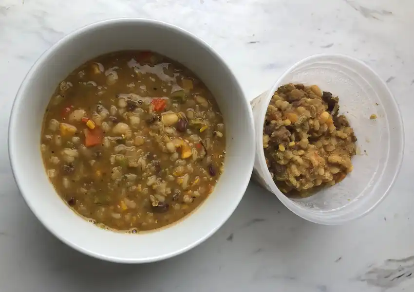 A close up of a bowl of beef barley fresh from the pot to compare