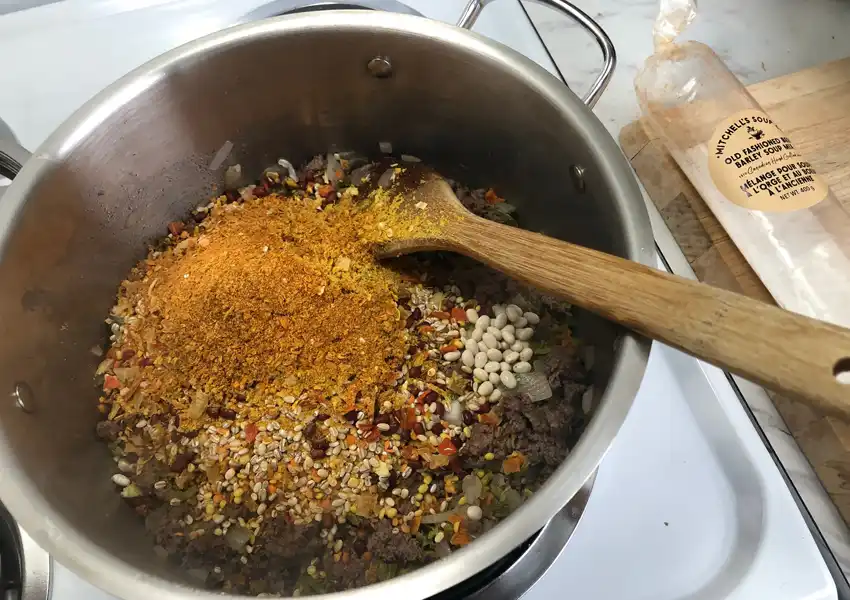 Showing Mitchell's Soup ingredients in a stock pot on the stove before adding water