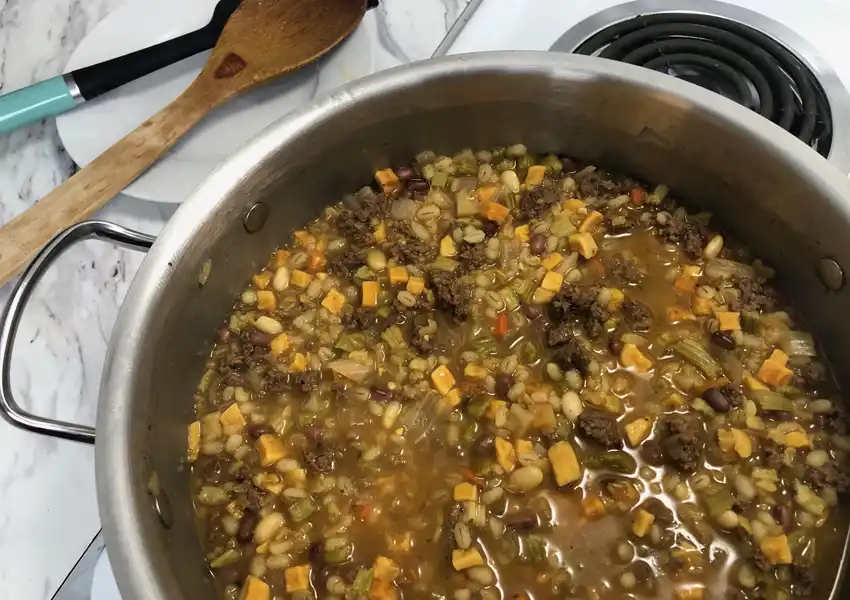Close-up showing the soup after cooking in a pot on a stove