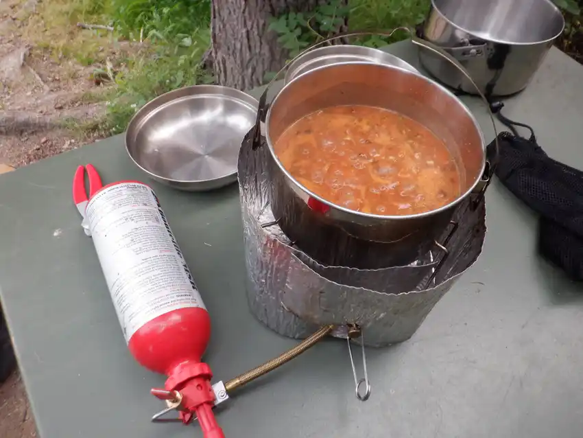 Close up photo of a pot of soup cooking on an MSR Dragonfly stove
