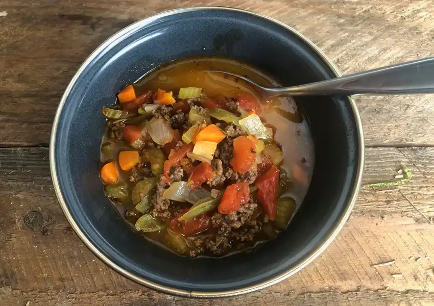 A bowl of hamburger soup made from all dehydrated ingredients