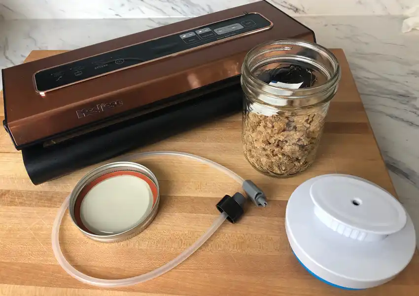 Dehydrated chicken stored in a canning mason jar and a vacuum sealer to seal it