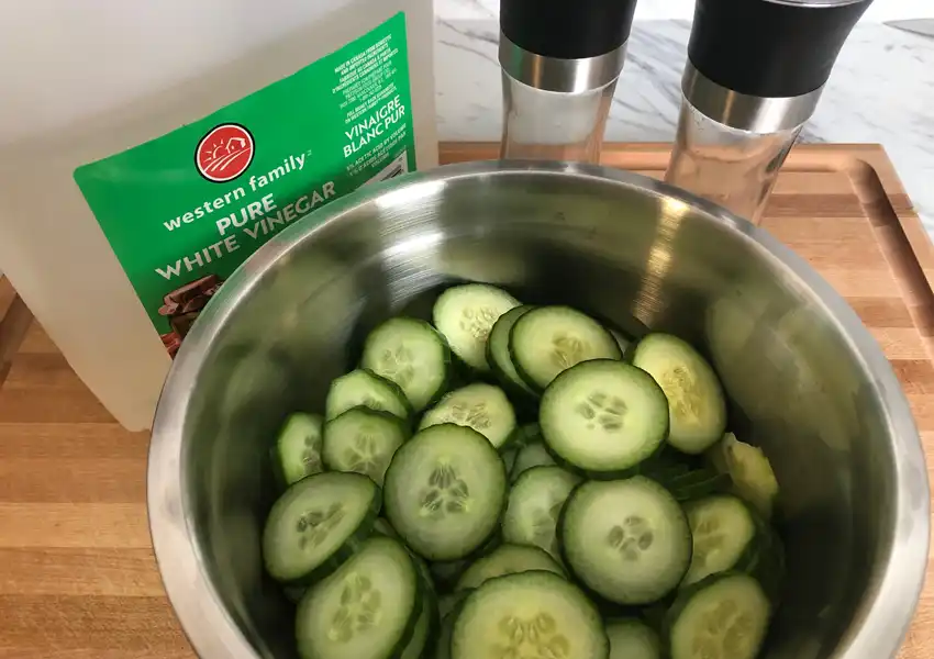 Displaying sliced cucumbers getting ready for a vinegar soak